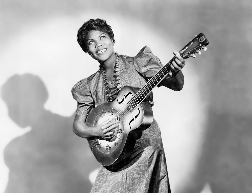 Publicity photo of American musician Sister Rosetta Tharpe posed with a guitar