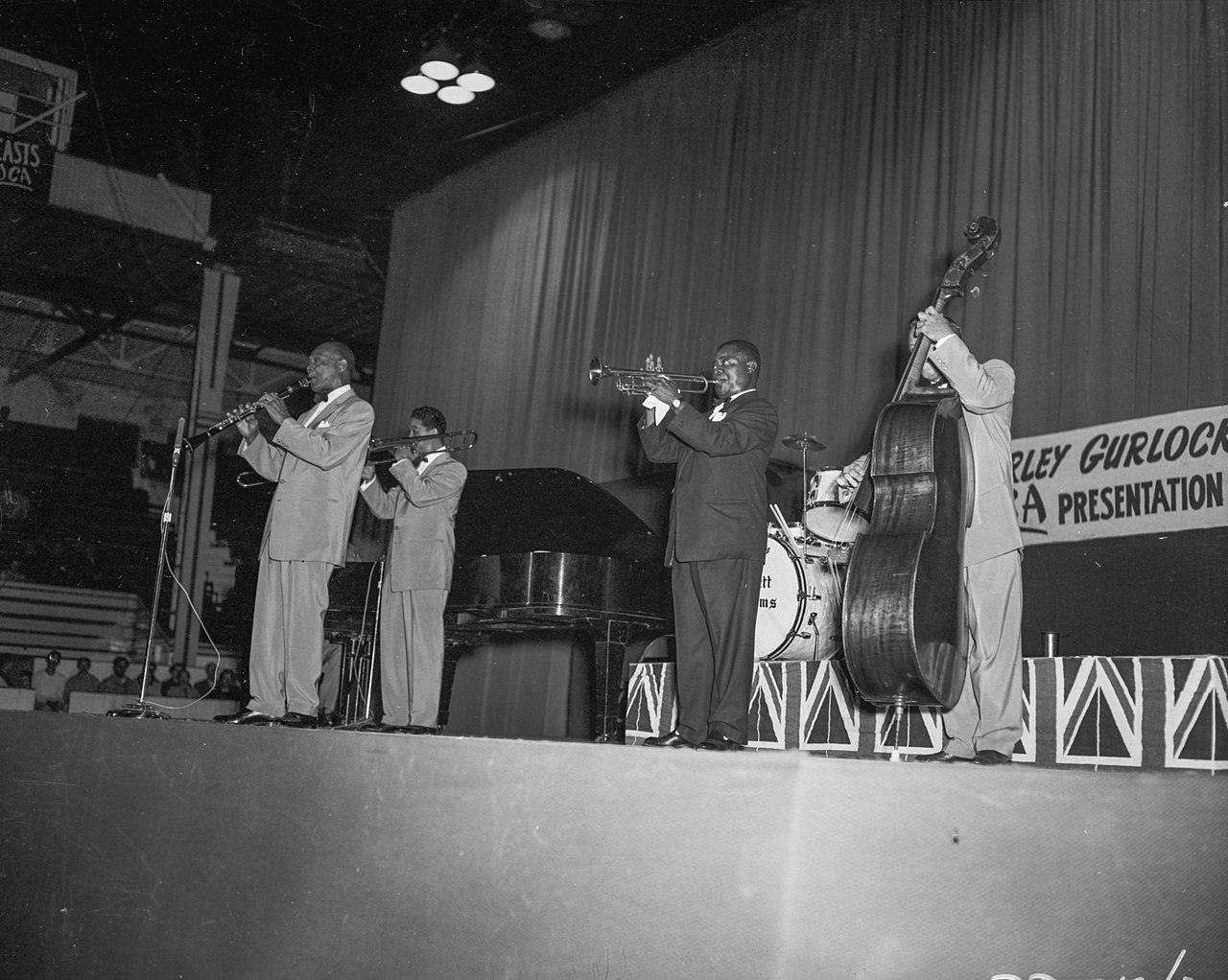 Grayscale Photo of Louis Armstrong and the All-Stars Perform in Edmonton Gardens.
