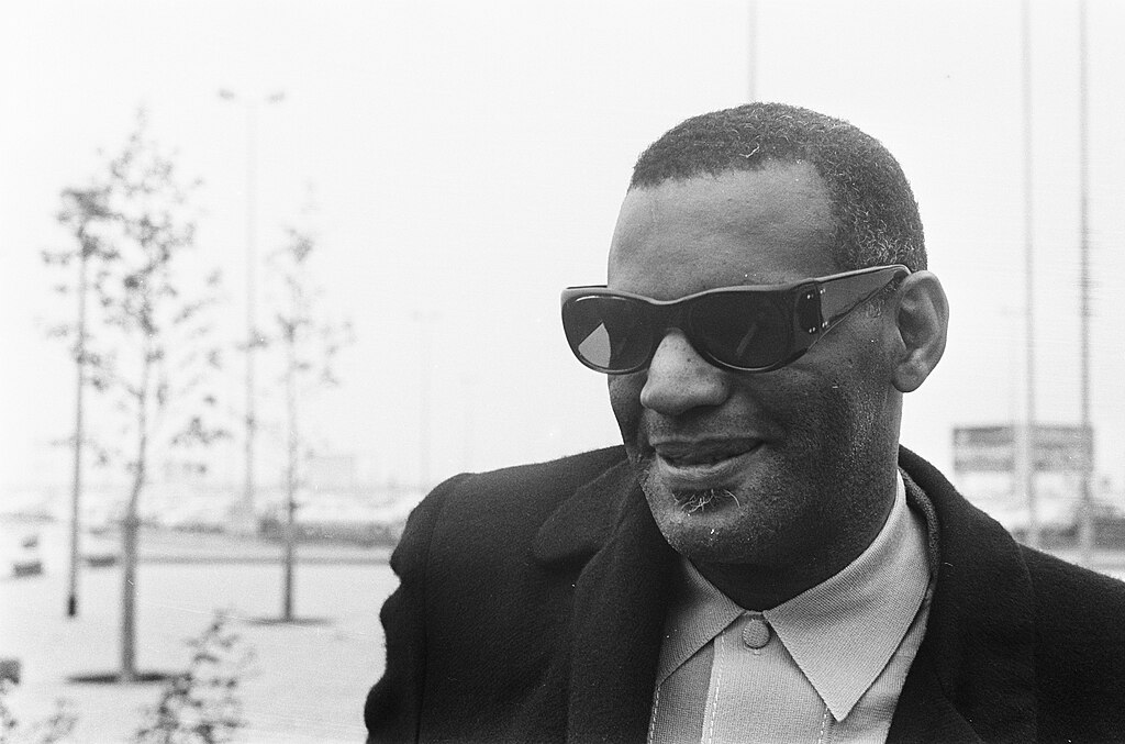 Grayscale Portrait Photo of Ray Charles wearing a dark suit