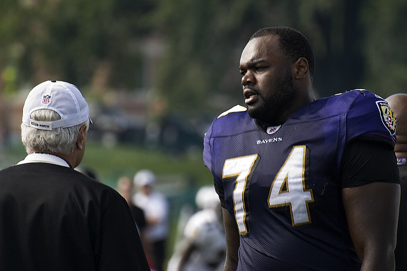 Portrait Photo of Michael Oher on  blurred background
