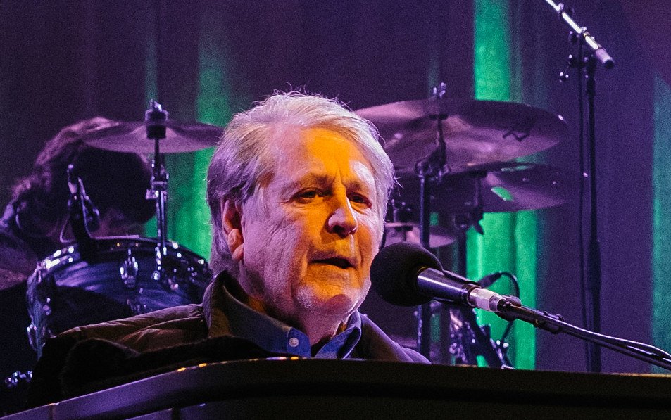 Portrait Photo of Brian Wilson performing on stage.