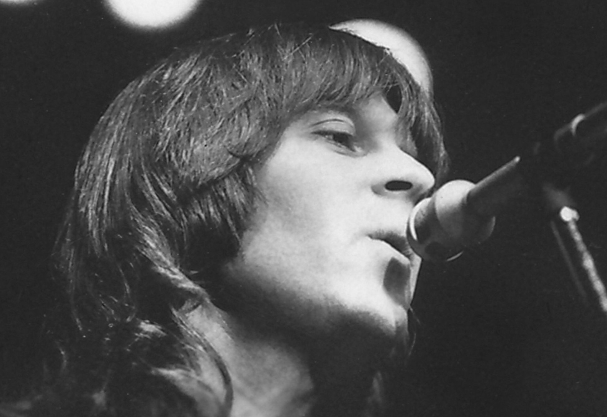 Grayscale Portrait Photo of Randy Meisner performing