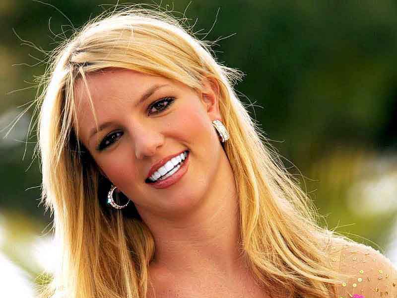 Portrait Photo of Britney Spears in a floral dress smiling