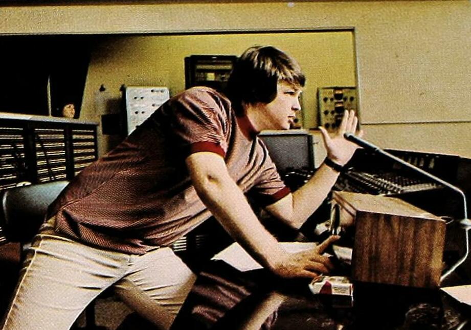 Portrait Photo of Brian Wilson in a studio looking to the right.