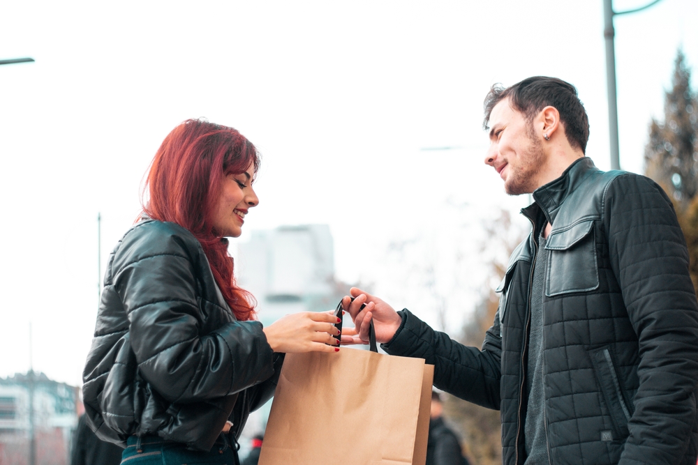 a man gives a woman a gift
