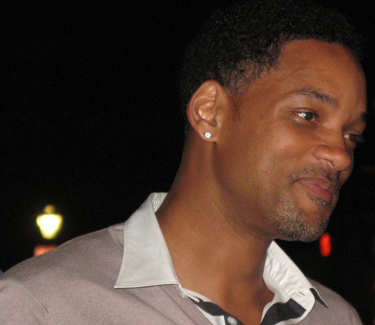 Portrait Photo of Will Smith in a gray shirt, smiling