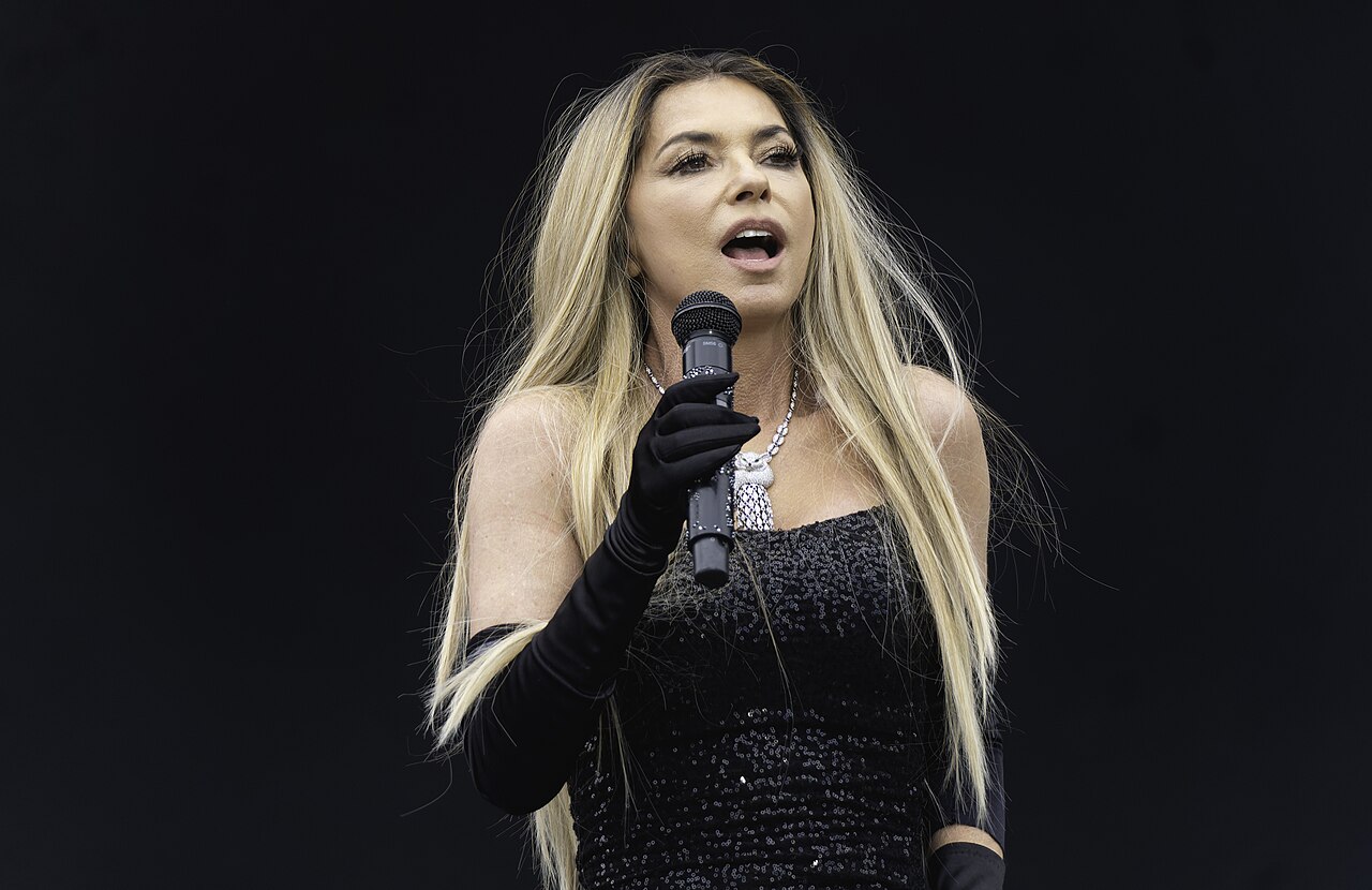 Shania Twain on stage in black dress - 2024