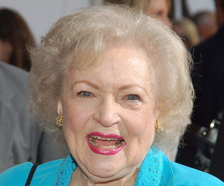 Portrait Photo of Betty White in a blue outfit, smiling