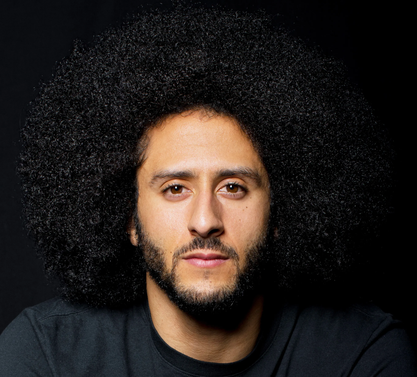 Portrait Photo of Colin Kaepernick in dark outfit