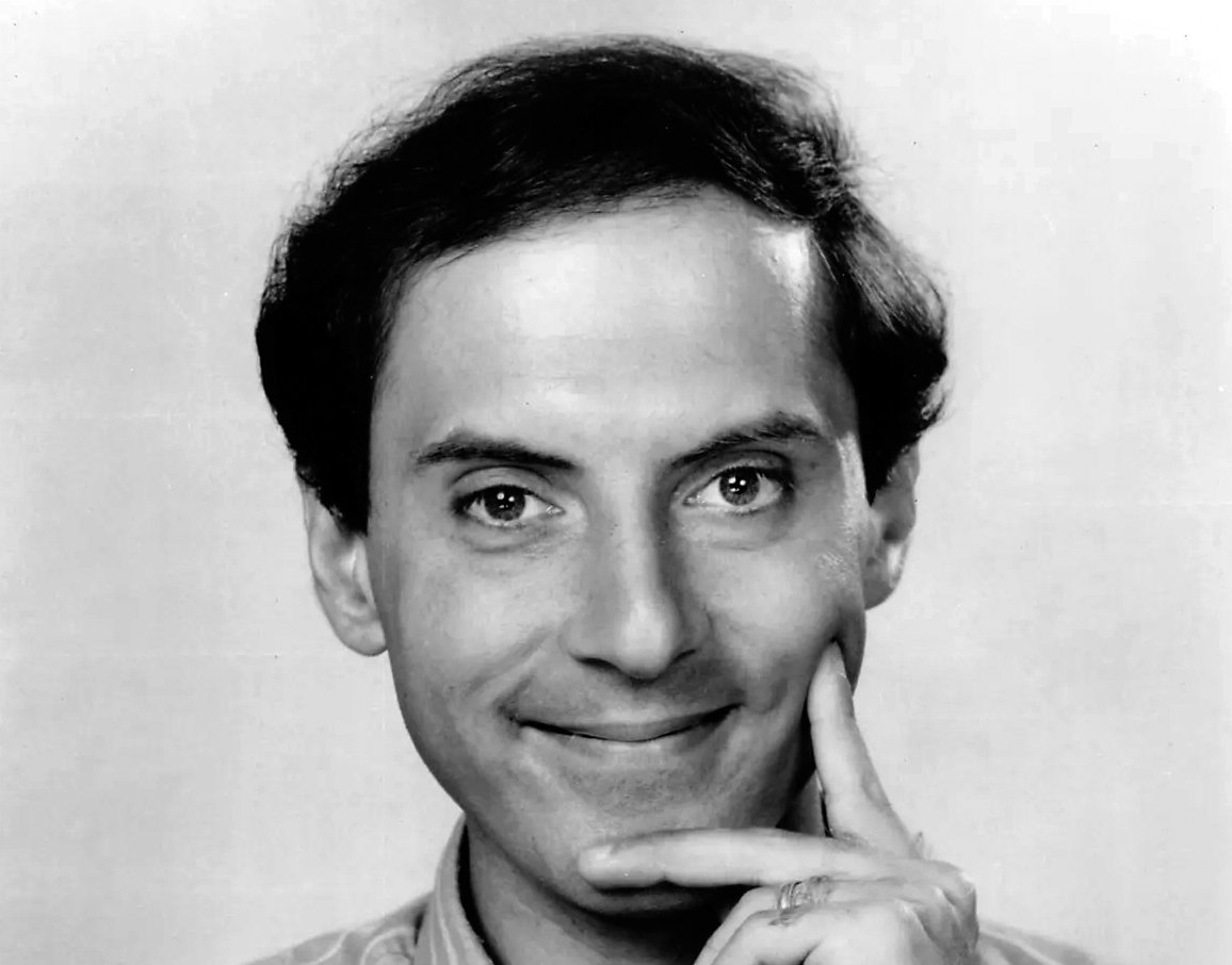 Grayscale Portrait Photo of Dan Castellaneta, smiling
