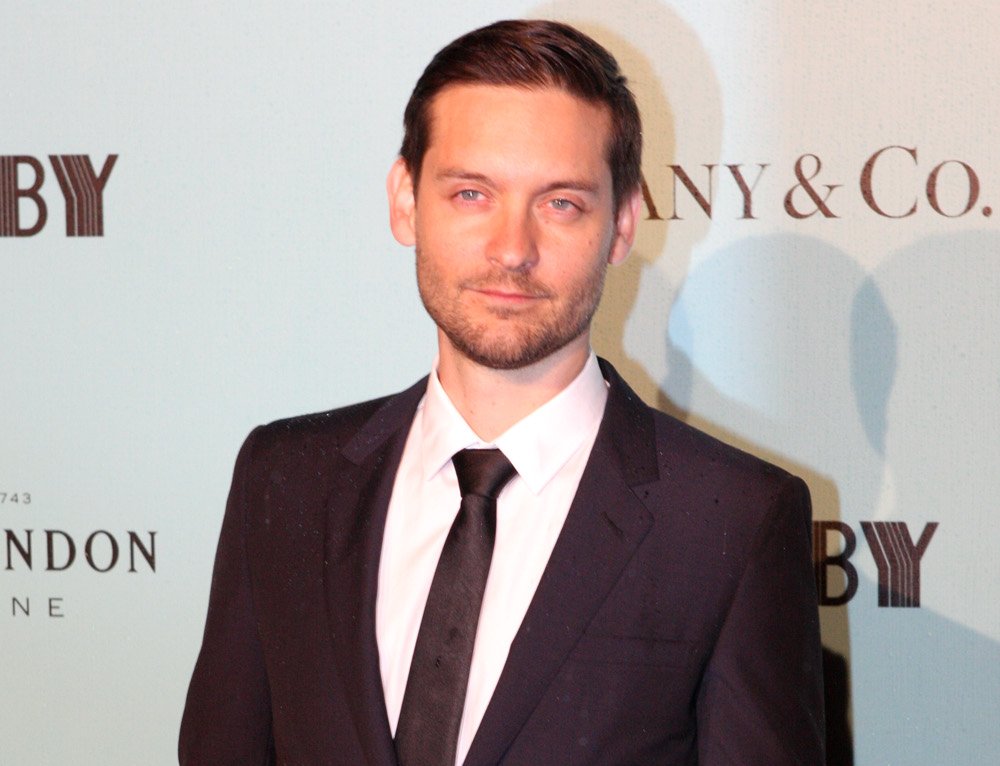 Portrait Photo of Tobey Maguire in a dark suit
