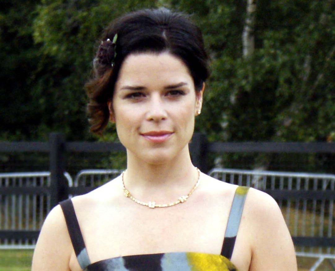 Portrait Photo of the Actress Neve Campbell in a floral dress