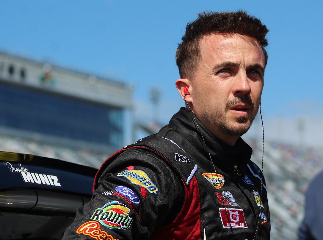 Portrait Photo of Frankie Muniz in a car racing suit