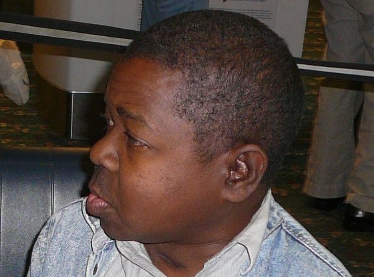 Portrait Photo of Gary Coleman in Denim outfit, looking to the left