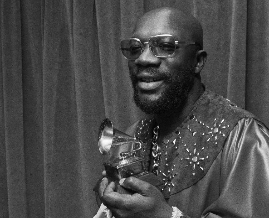 Photo of Isaac Hayes holding his Grammy award for Shaft in 1972
