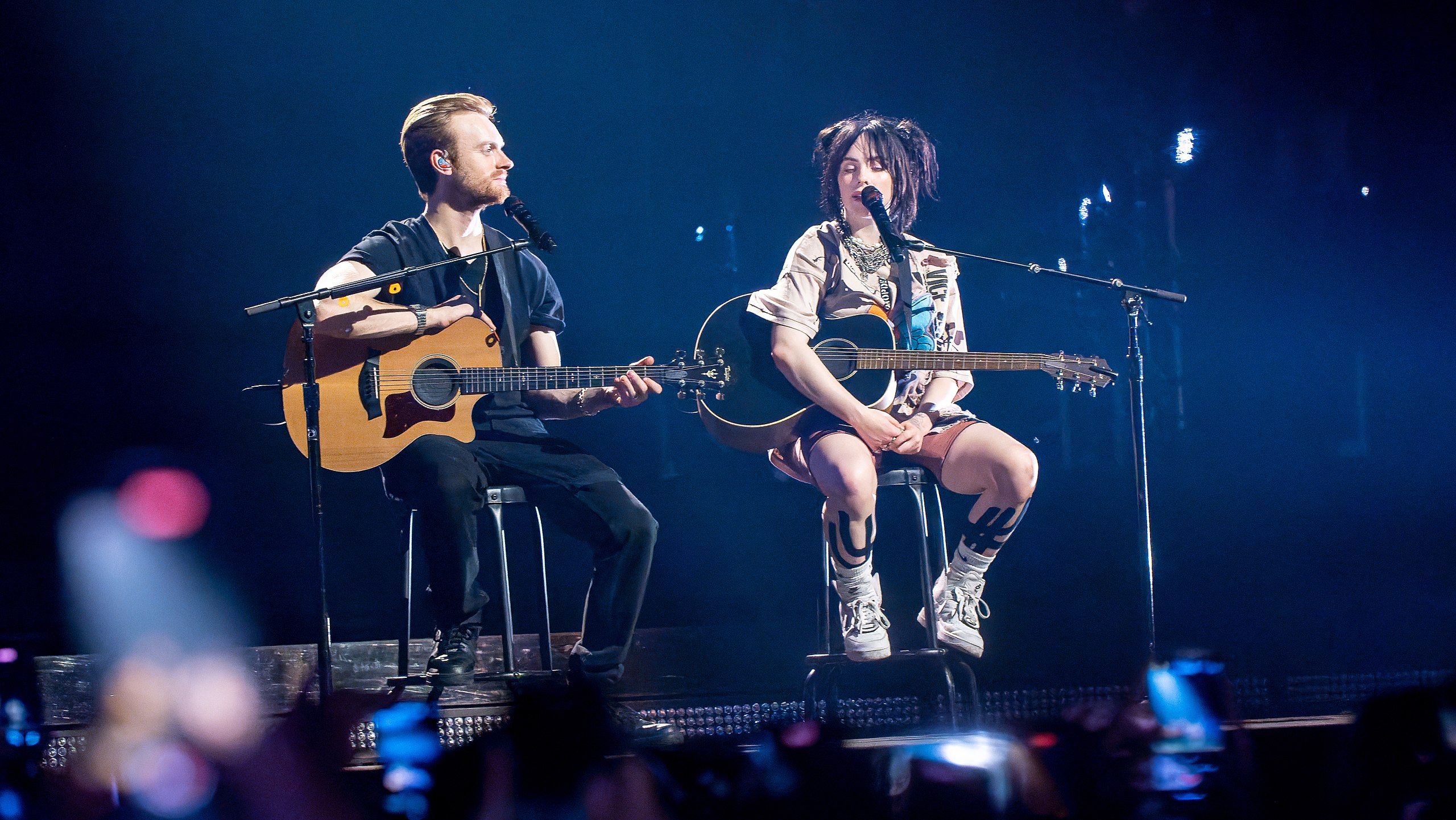 Billie Eilish and Finneas O'Connell performing in the Happier Than Ever, The World Tour (2022)