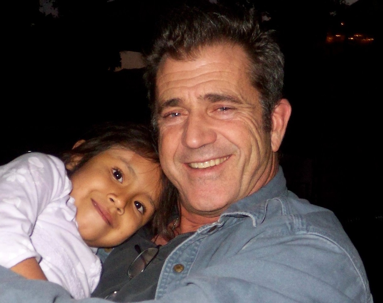 Mel Gibson holds Domenica, foster child from Ecuador - 2007