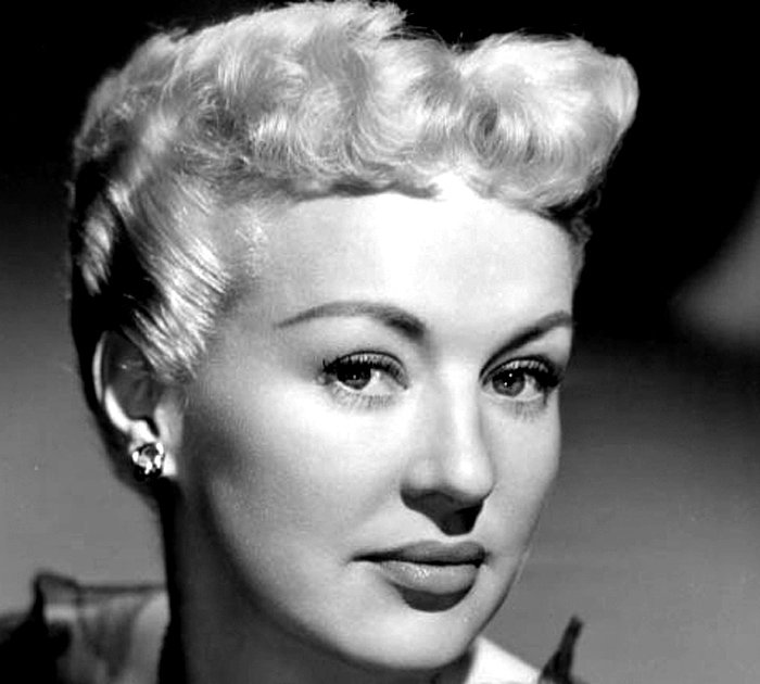 Grayscale Portrait Photo of Betty Grable in a black dress