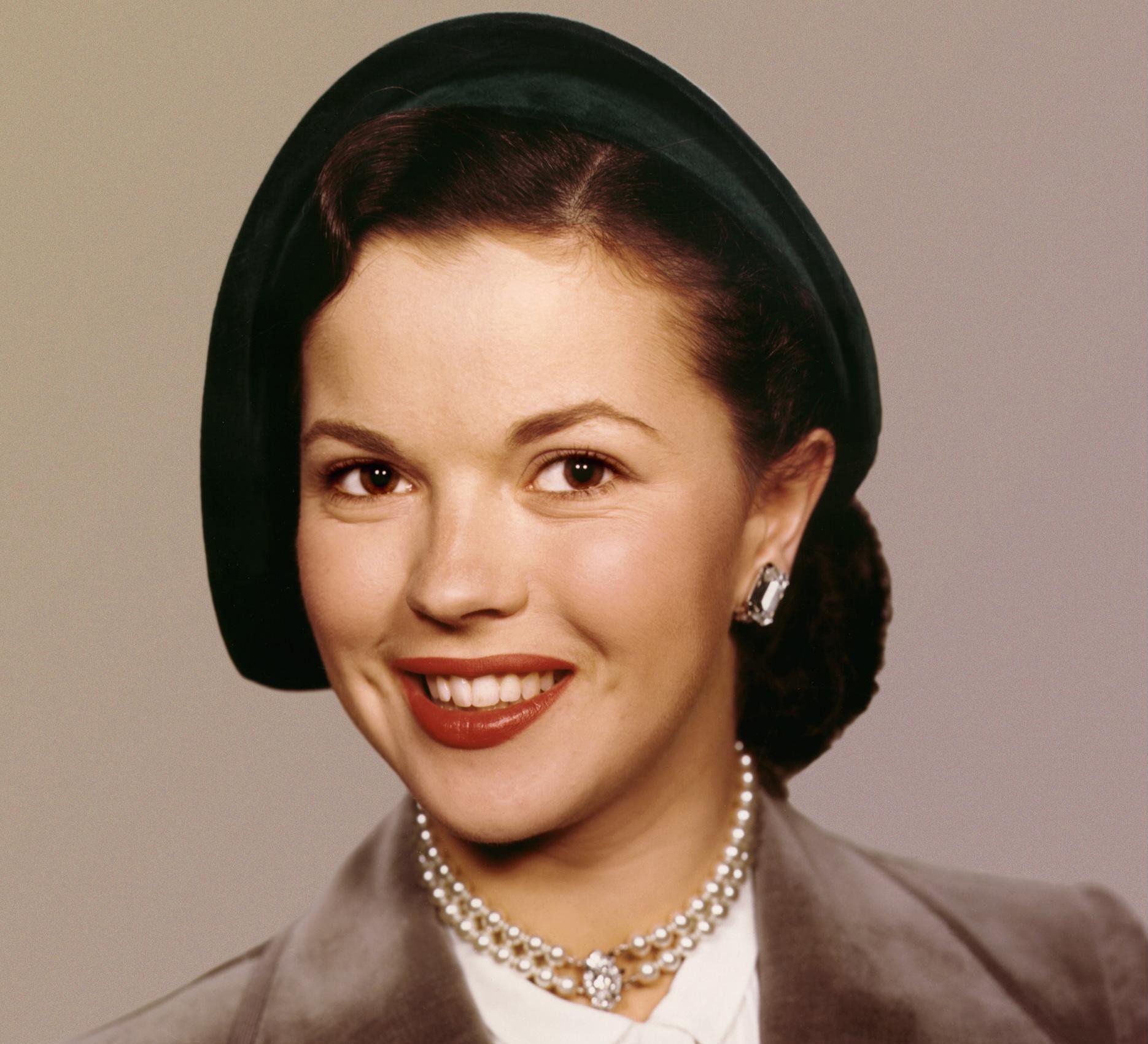 Portrait Photo of the Actress Shirley Temple in a brown outfit