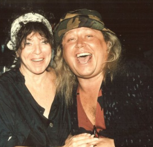 Mitzi Shore and Sam Kinison in black