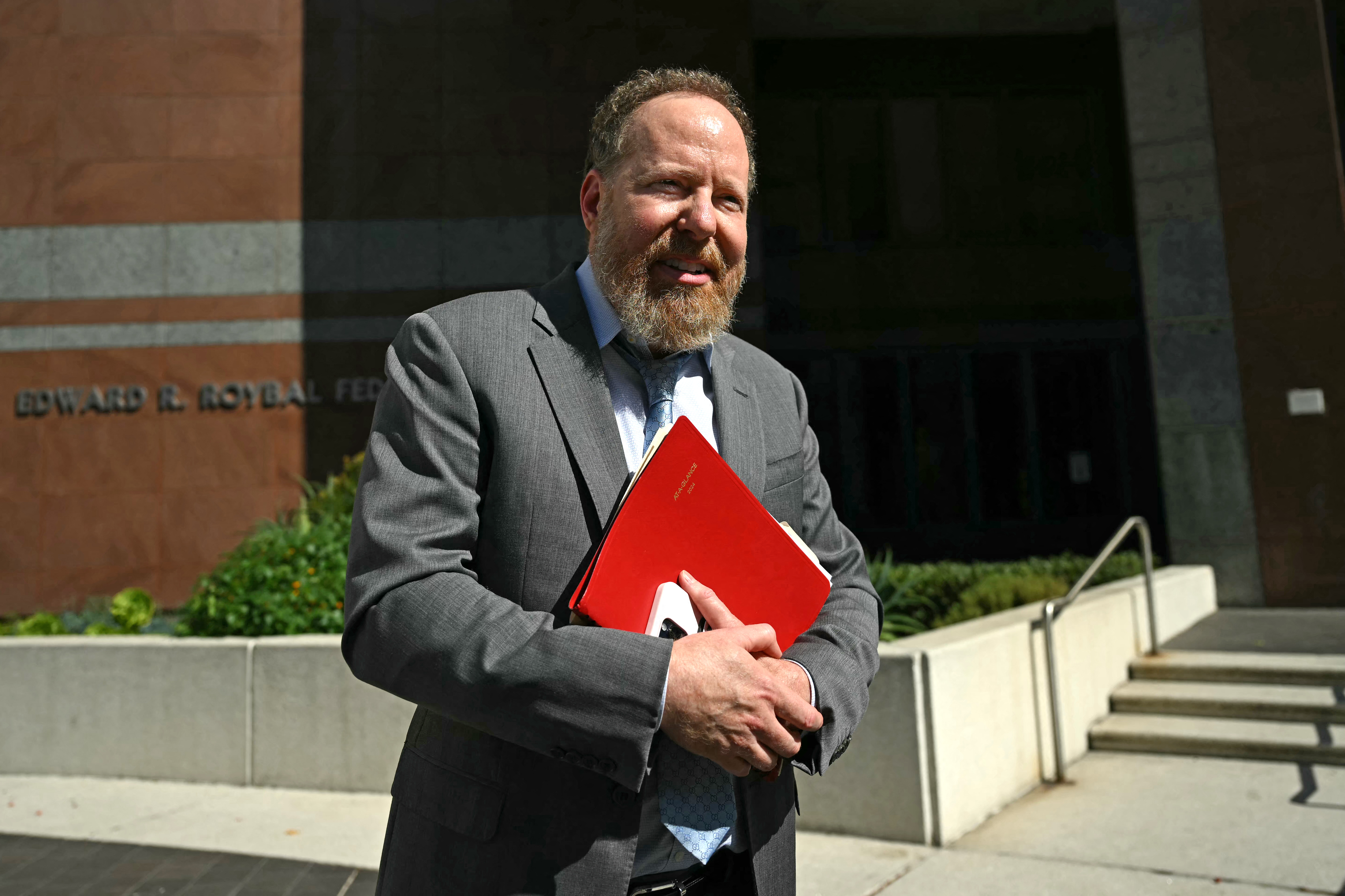 Salvador Plasencia's attorney Stefan Eric Sacks speaks with the press outside the Edward R. Roybal Center and Federal Building following a press conference announcing arrests in the death of
