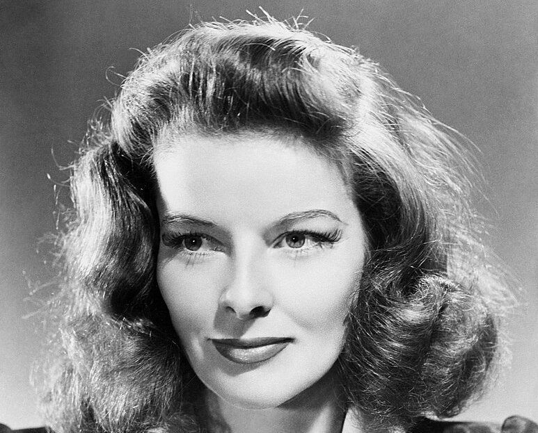 Grayscale Portrait Photo of Katharine Hepburn, smiling, facing the camera