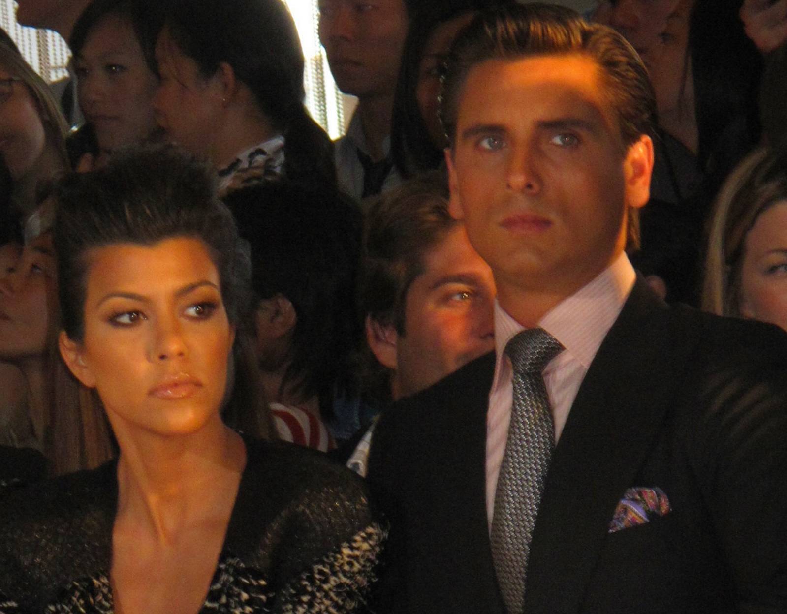 Scott Disick & Kourtney Kardashian attending a fashion show