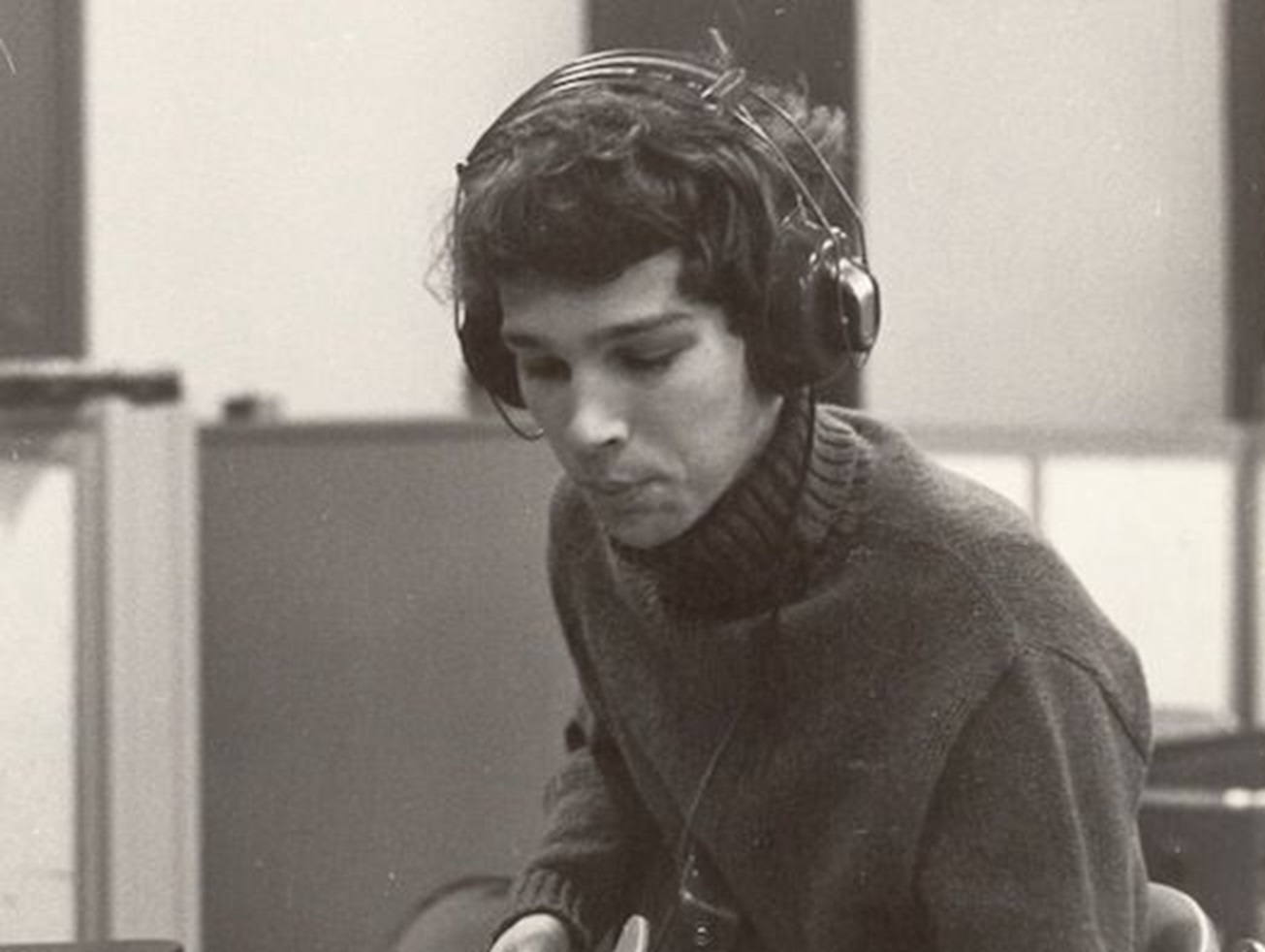 Chris Bell listening music on headphones.