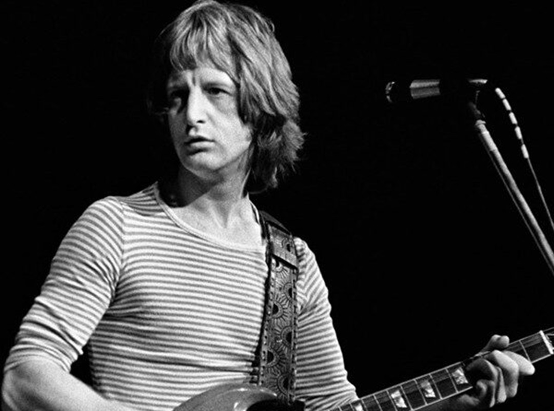 Pete Ham performing on stage.