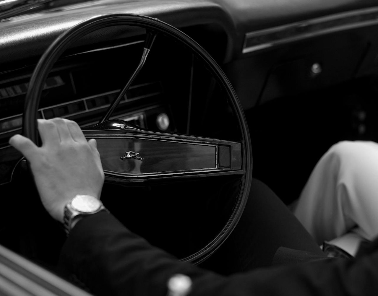 Man Driving a Classic Car