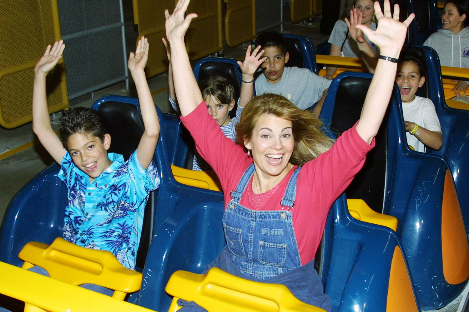Actress Lisa Whelchel and her son get ready to ride Goliath, a roller coaster, at Six Flags Magic Mountain March 29, 2001 in Valencia, CA.