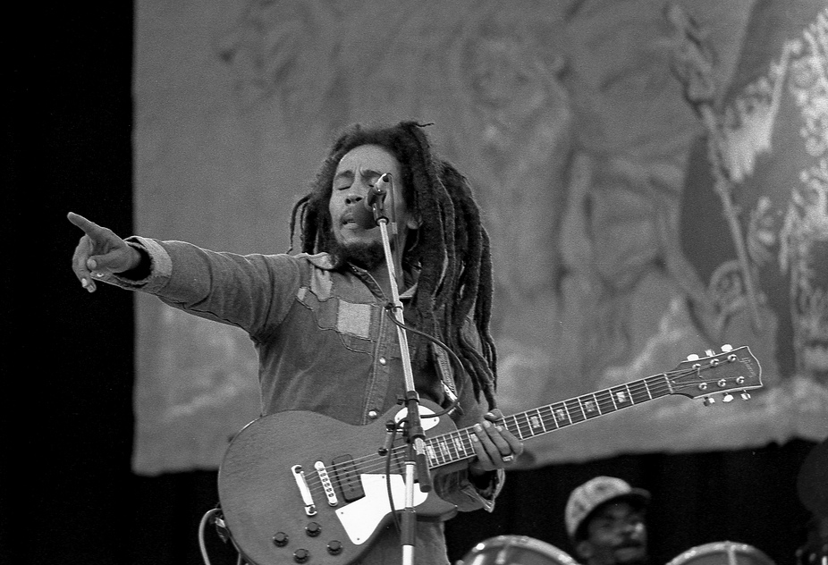 Grayscale Portrait Photo of Bob Marley performing at Dalymount Park