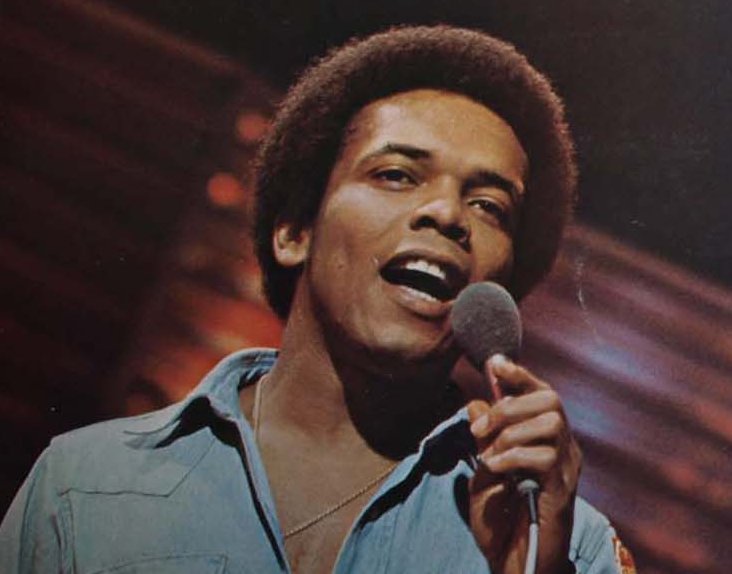 Portrait Photo of American singer and songwriter Johnny Nash in blue shirt