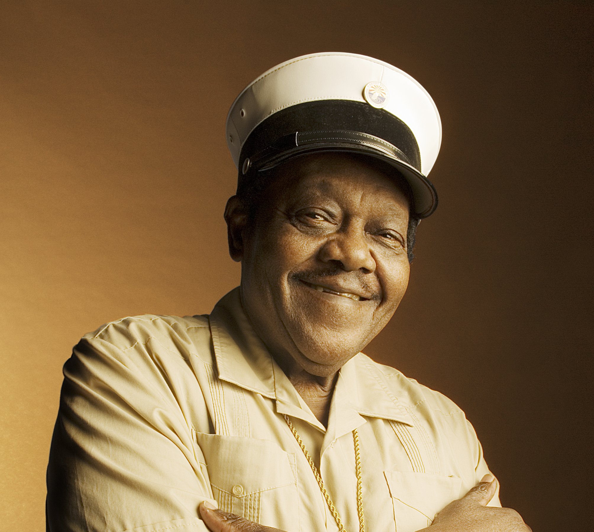 Portrait Photo of Fats Domino in white shirt and white hat