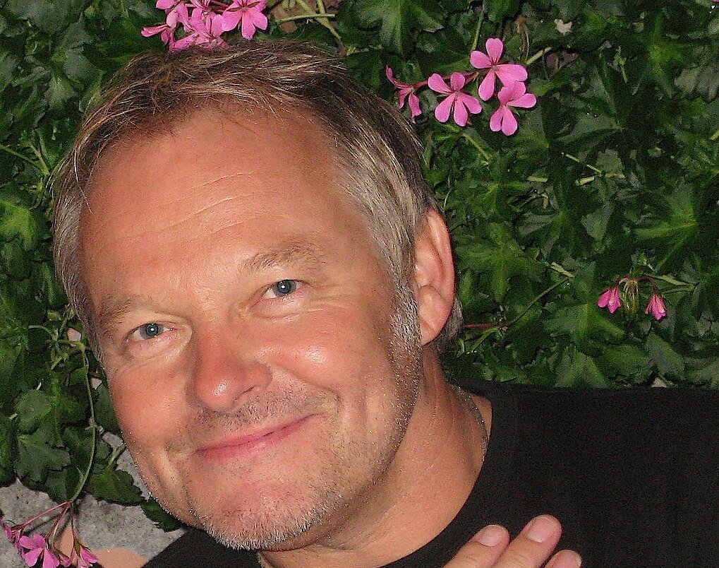 Portrait Photo of Nick Van Eede, smiling, facing the camera