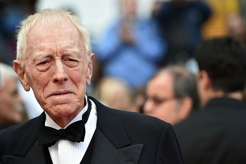 Max von Sydow wearing black suit