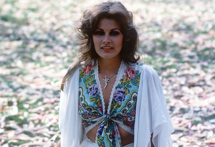 Ginger Alden earing a white dress with flowers