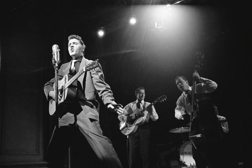 Elvis Presley with his guitar