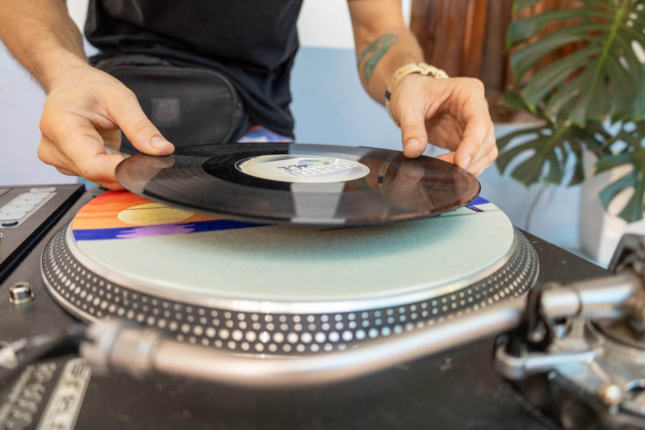 A person is holding a record