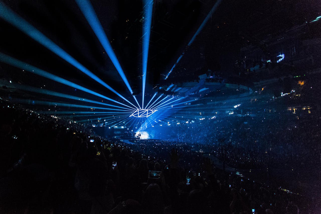 People on arena with lighted stage