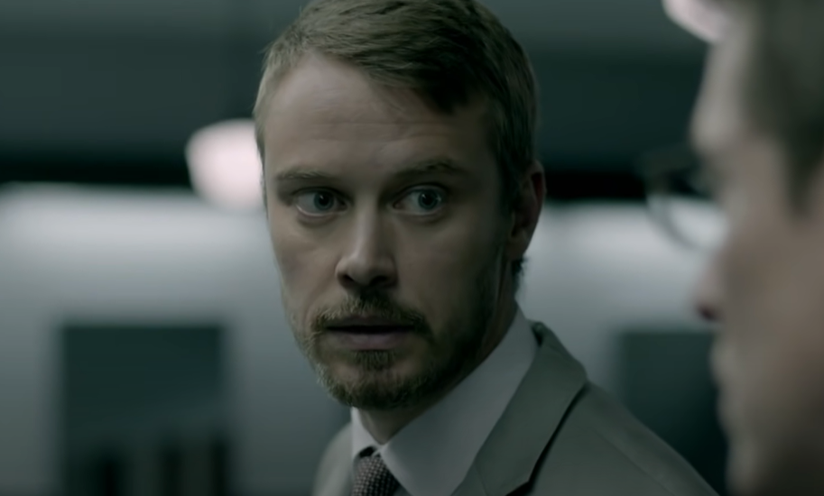 Michael Dorman as John Tavner