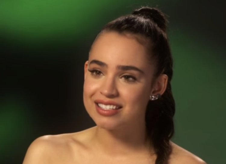 Sofia Carson  looking away from the camera
