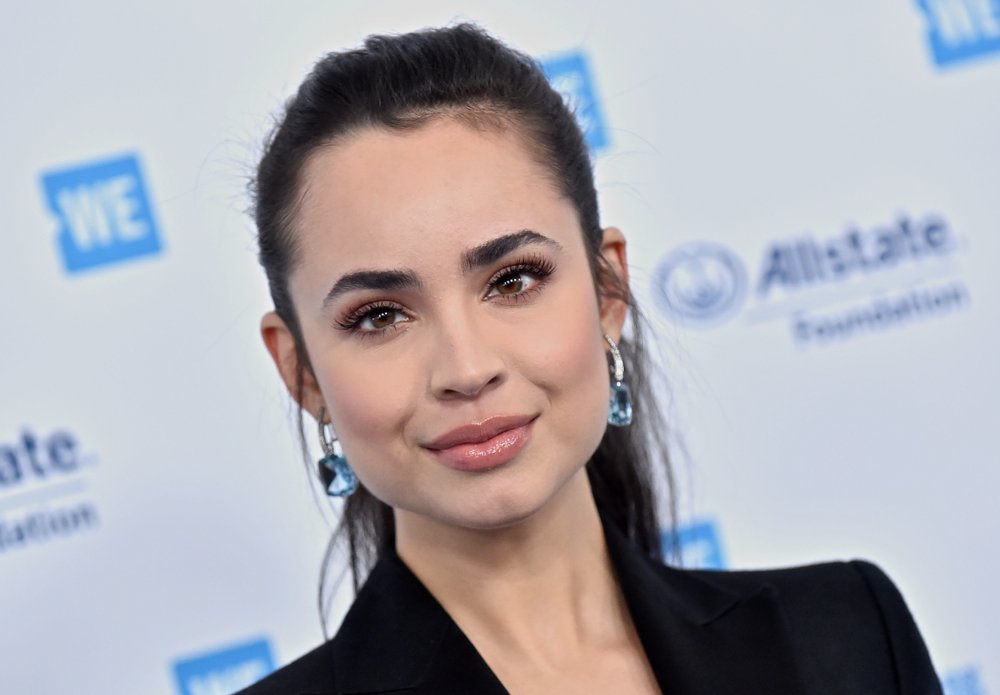 Sofia Carson wearing a black top
