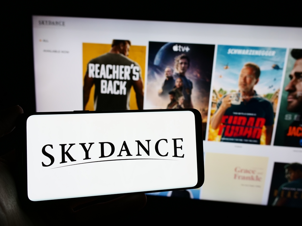 Person holding cellphone with logo of US movie production company Skydance