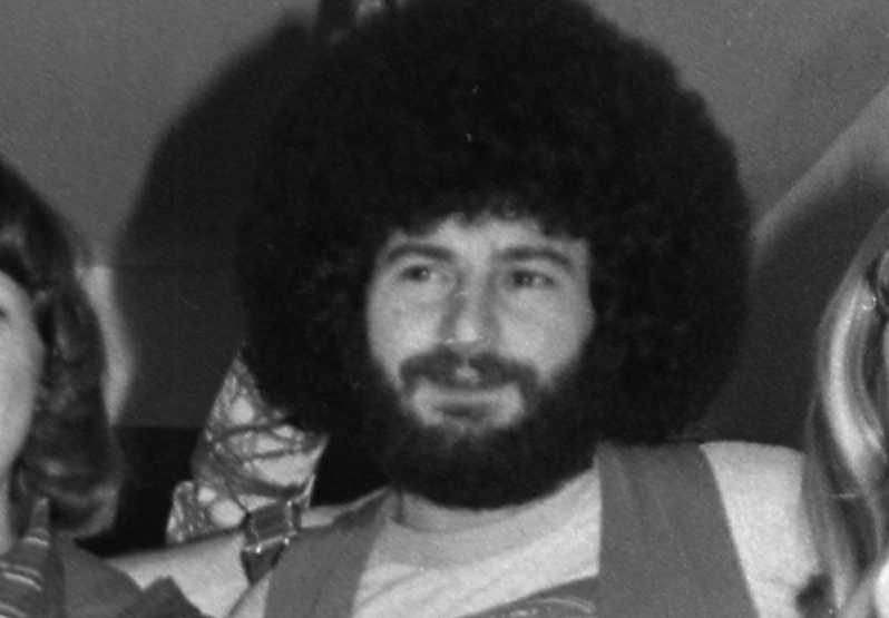 Brad Delp (1951-2007) and Sib Hashian (1949-2017), both of the rock band Boston