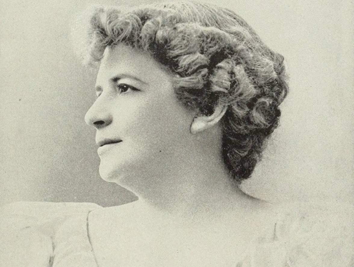 Eugenie Blair in white lace dress