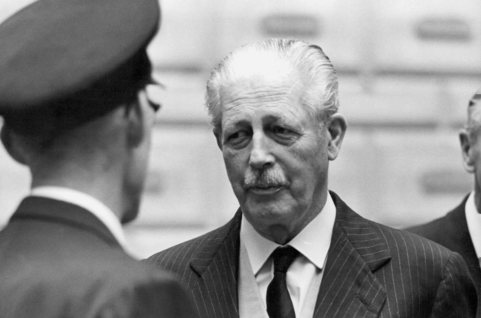 Harold Macmillan in conversation with the palace caretaker