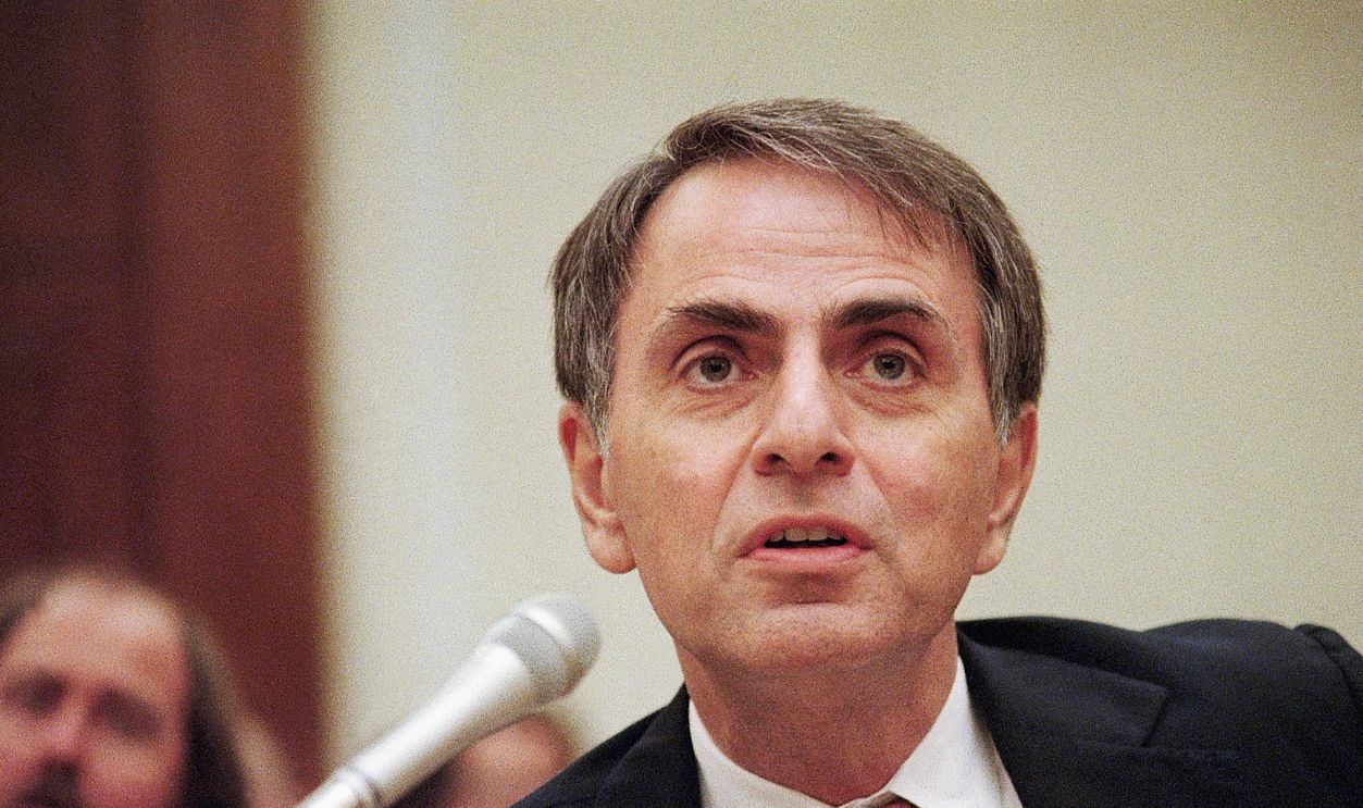 Gettyimages - 515454886, Carl Sagan Testifies At House Hearing (Original Caption) 7/22/1986-Washington, DC- Dr. Carl Sagan is shown testifying at a House hearing on the future of space.