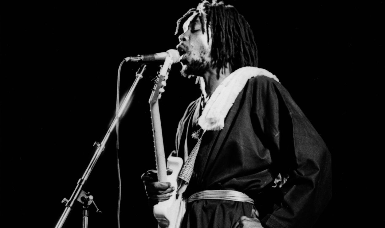Photo of Peter TOSH; Peter Tosh performing on stage at the