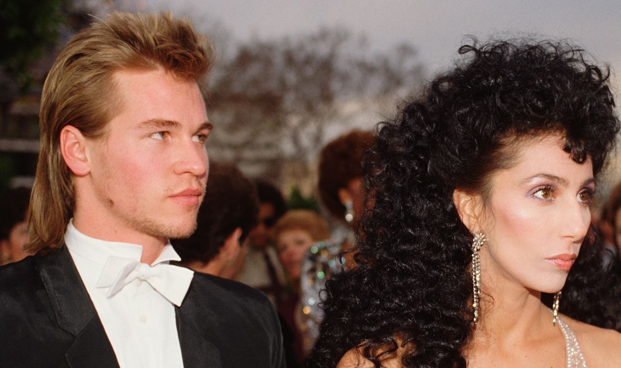 American actors Cher and Val Kilmer arrive at the 56th Academy Awards, where Cher is nominated for Best Supporting Actress in Silkwood.